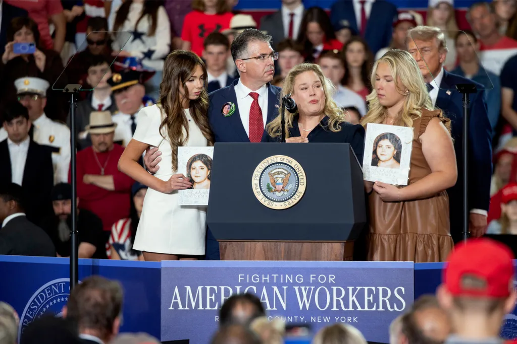 Speakers at a Trump and Lawler rally in Monsey, New York, with the presidential seal on the podium